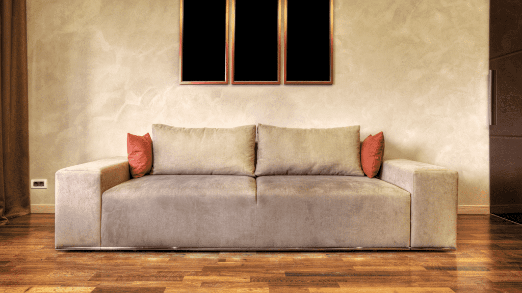 A painting behind a brown leather sofa can look great