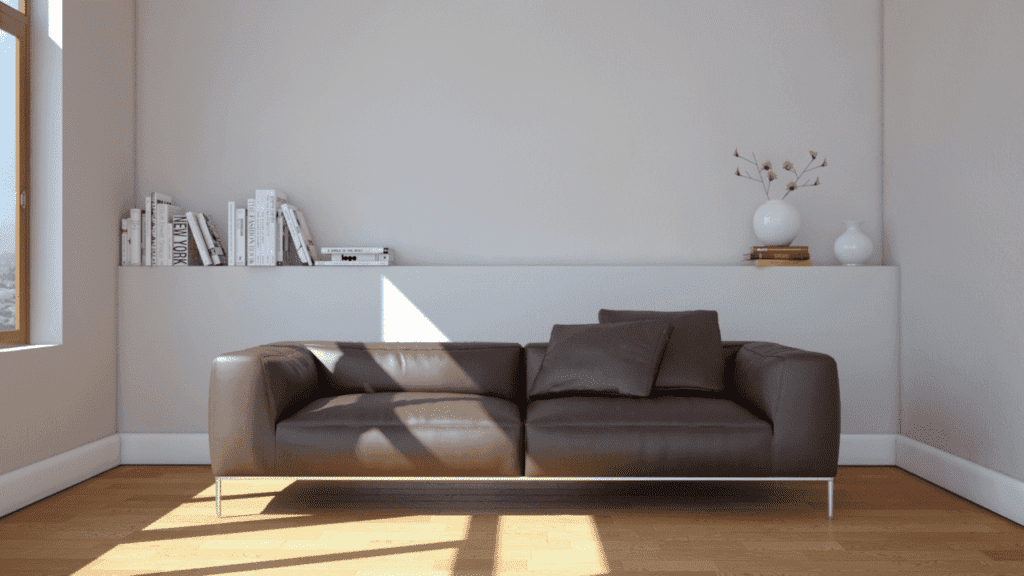 Combine a brown leather sofa with a white wall
